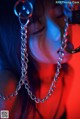 A woman with a chain around her neck. 